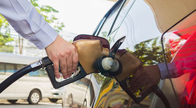 man-putting-gasoline-fuel-into-his-car-pump-gas-station